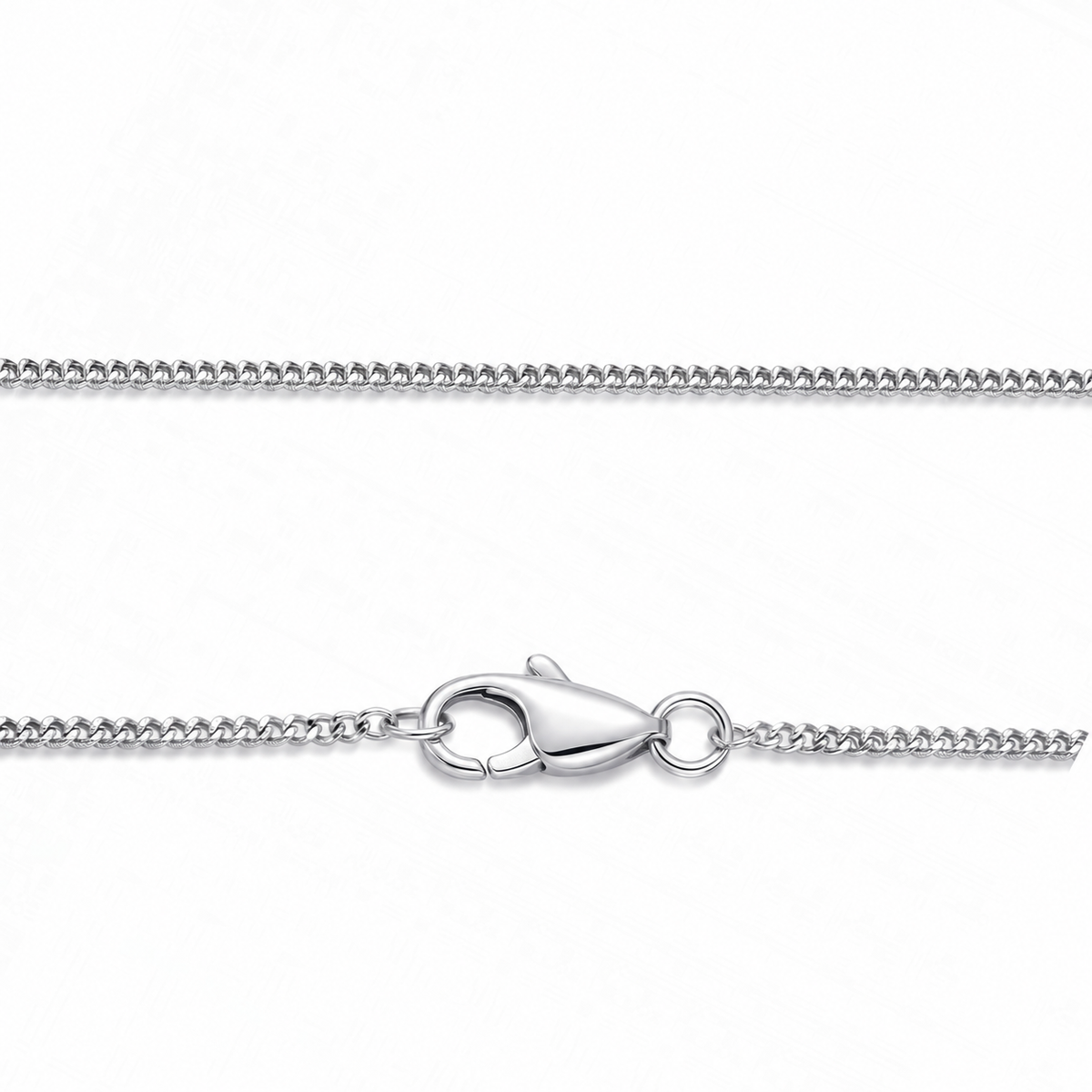 Close-up of the polished flat curb links and lobster clasp of HELIOR's Cadence Fine 1.2mm PT950 platinum necklace.