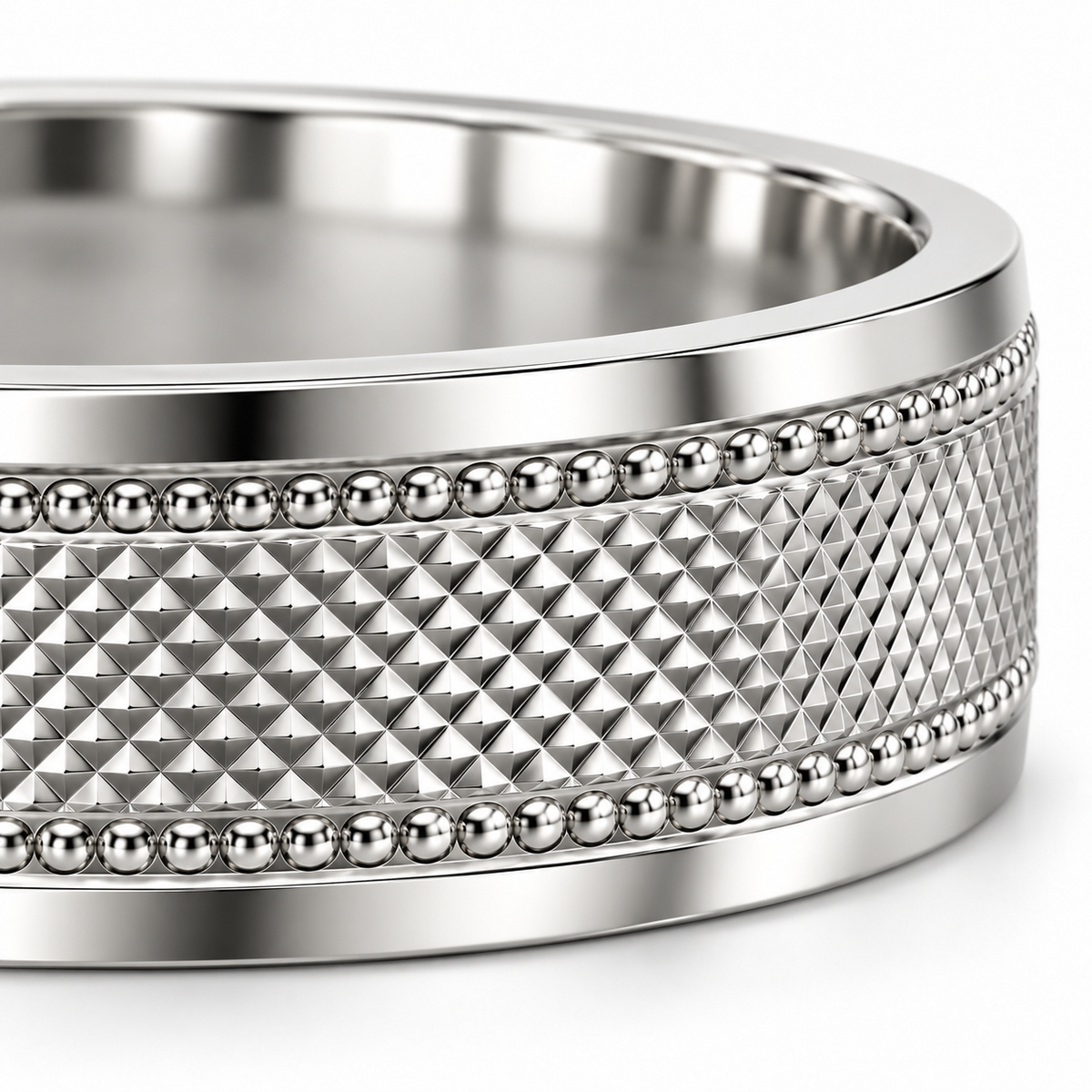 Macro detail of the Clous platinum ring showing pyramidal facets, milgrain beads and polished borders.