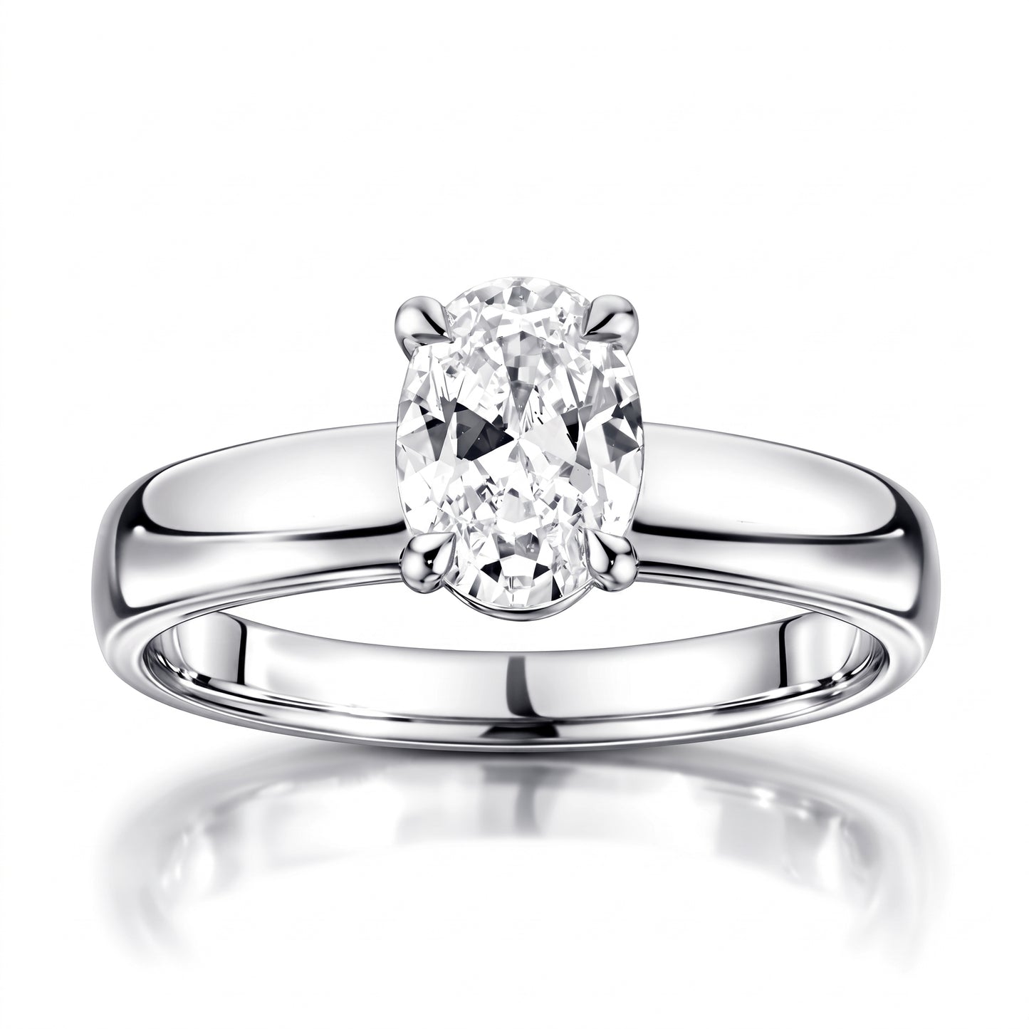 An oval-cut diamond solitaire engagement ring in a polished four-prong setting on a sleek platinum band, shown against a clean white background with a soft reflection below.