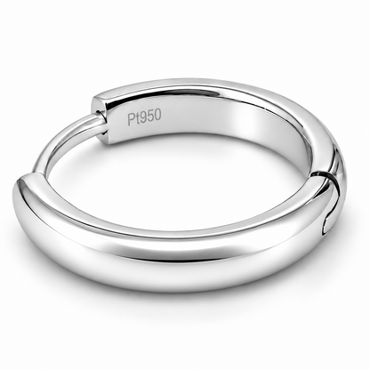 A polished platinum earring  with a smooth, rounded exterior and a visible 'Pt950' engraving on the inside, set against a clean white background.