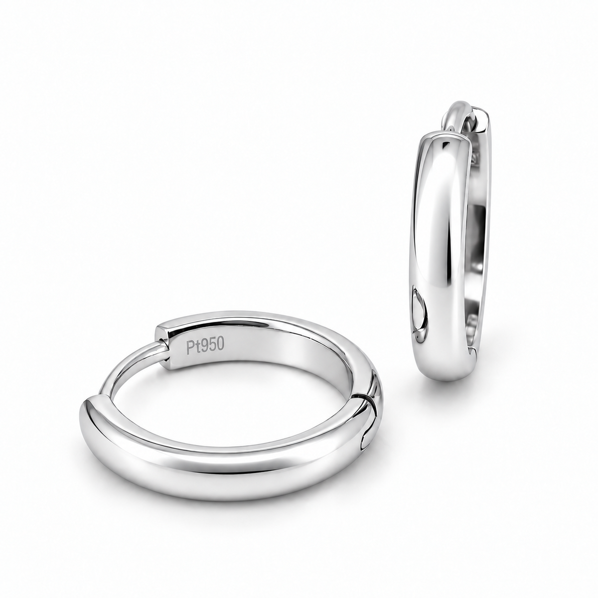 A pair of polished platinum huggie hoop earrings, one shown from the front displaying a 'P950' engraving and the other from the side, on a clean white background.