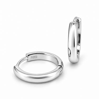 A pair of polished platinum huggie hoop earrings, one shown from the front displaying a 'P950' engraving and the other from the side, on a clean white background.