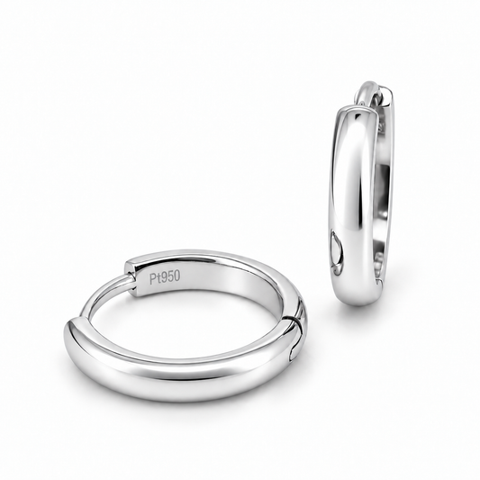 A pair of polished platinum huggie hoop earrings, one shown from the front displaying a 'P950' engraving and the other from the side, on a clean white background.