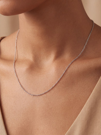 HELIOR 1.9mm platinum cable chain worn with an ivory top