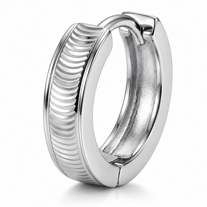 Macro detail of the Vela PT950 platinum hoop showing curved ridges and hinged clasp