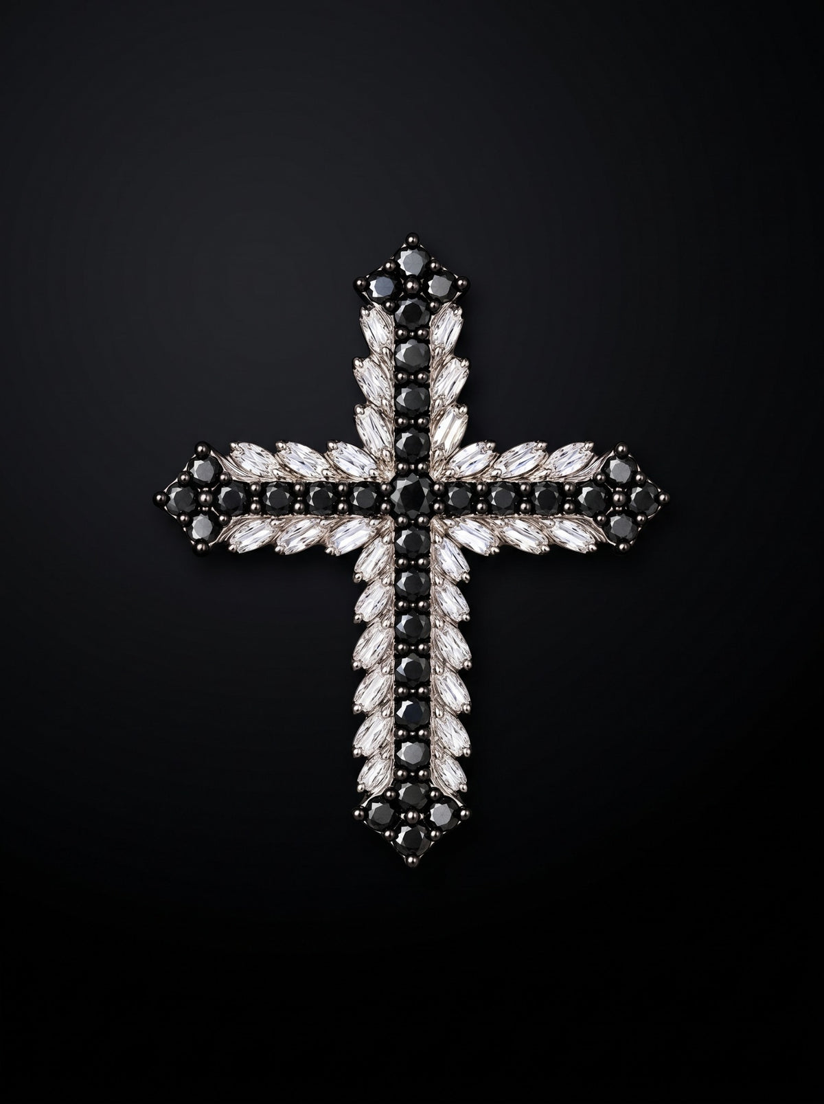 Eclipse natural black and marquise white diamond cross pendant on a dark background.