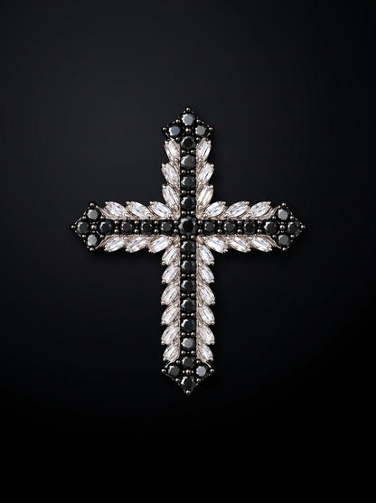 Eclipse natural black and marquise white diamond cross pendant on a dark background.