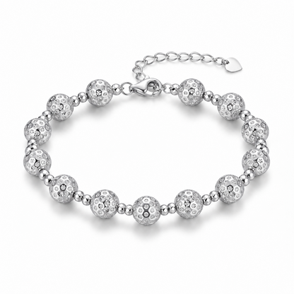 HELIOR Aster PT950 platinum bead bracelet with 8mm patterned beads, paired smaller faceted beads, lobster clasp and heart-tag extender on white.