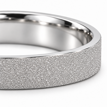 Close-up of the Dune platinum band's fine frosted texture, clean edge and polished interior.