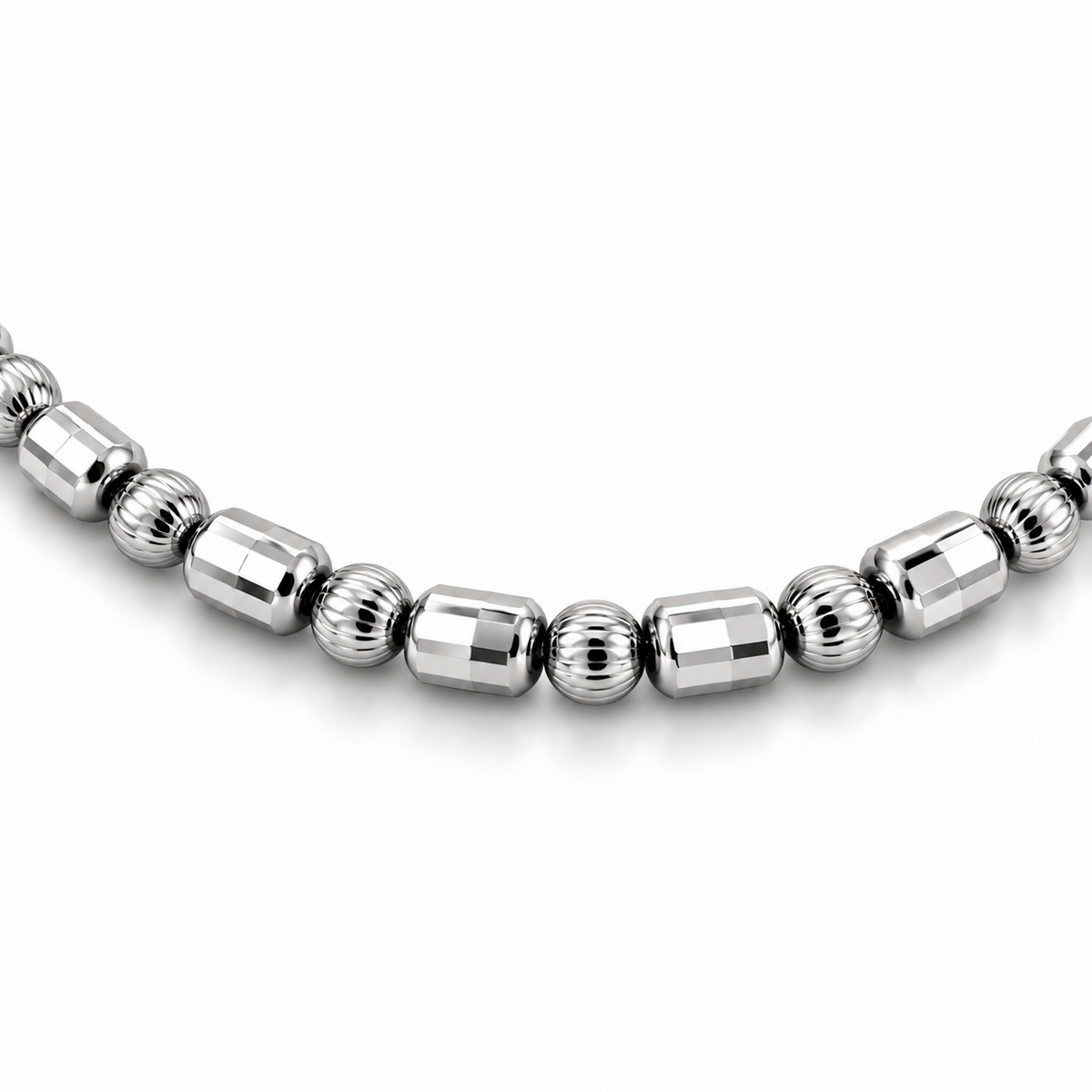 Close-up of HELIOR Orbit platinum bracelet with faceted barrel beads alternating individually with finely ribbed round beads.