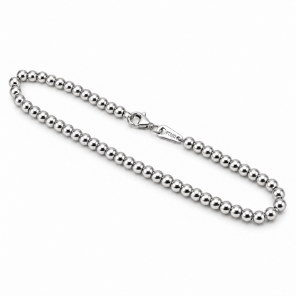 Angled view of the HELIOR Orbit PT950 platinum bead bracelet showing the rounded beads and lobster clasp