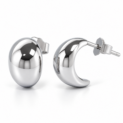 Angled view of HELIOR PT950 platinum moon stud earrings showing the curved side profile, posts and butterfly backs