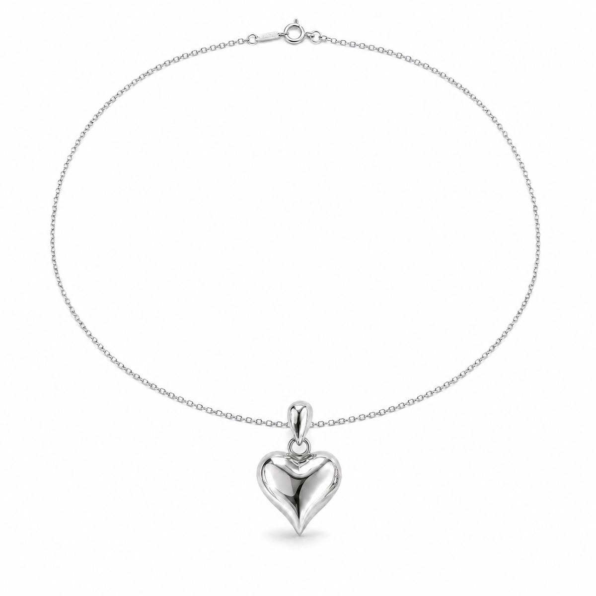 HELIOR PT950 platinum puffed heart pendant displayed on a cable chain against white; chain shown for styling only.