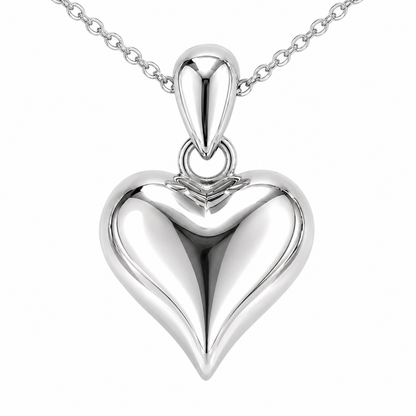 Front detail of the HELIOR PT950 platinum puffed heart pendant, showing its high-polish surface and teardrop-shaped bail.