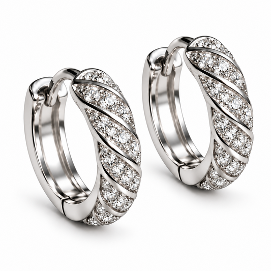 Pair of Spiral 18K white gold lab-grown diamond huggie hoop earrings on white