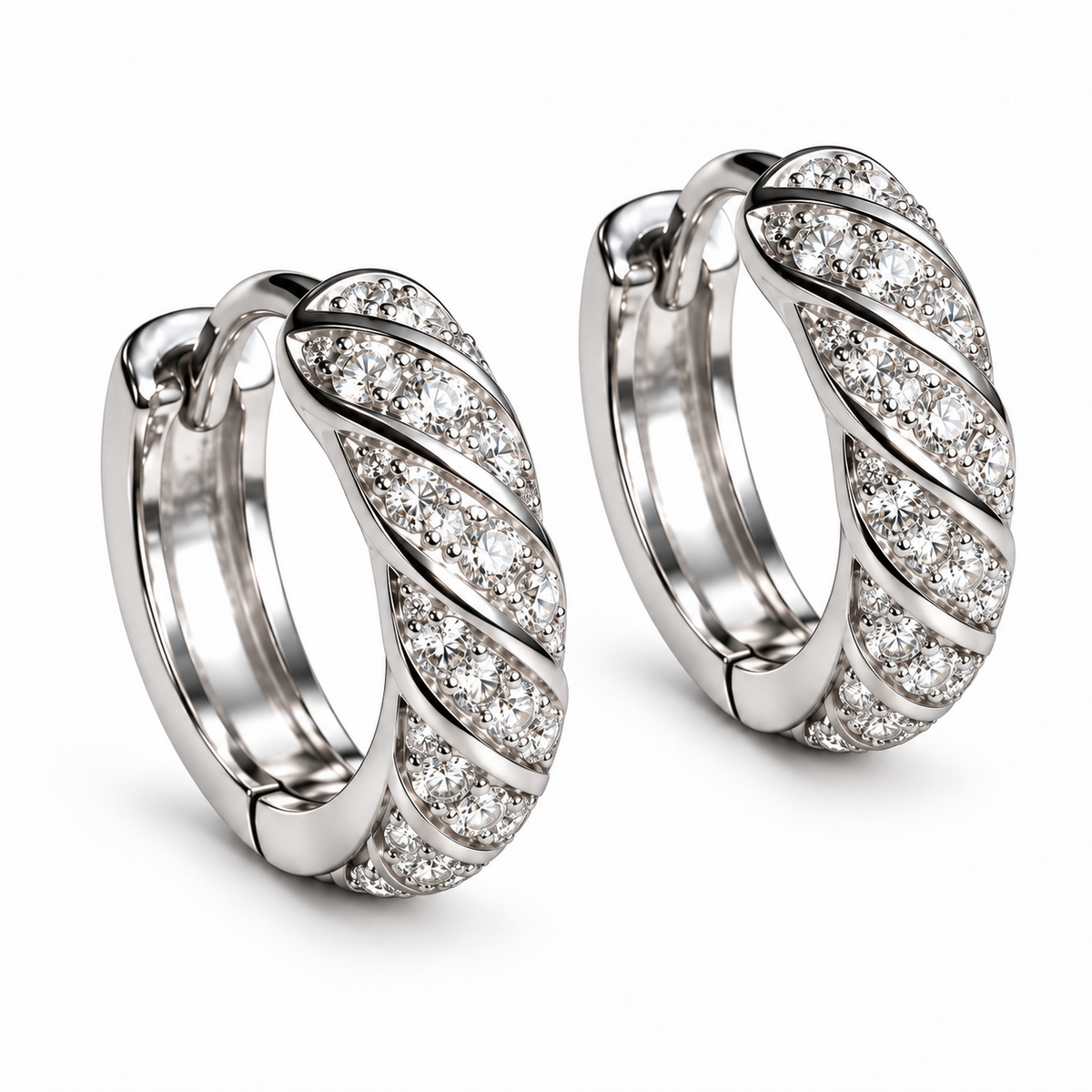 Spiral 18K white gold diamond huggie earrings showing the pavé front and hinged closure