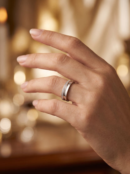 Strata PT950 platinum ring worn on a hand in warm light; actual scale depends on ring size