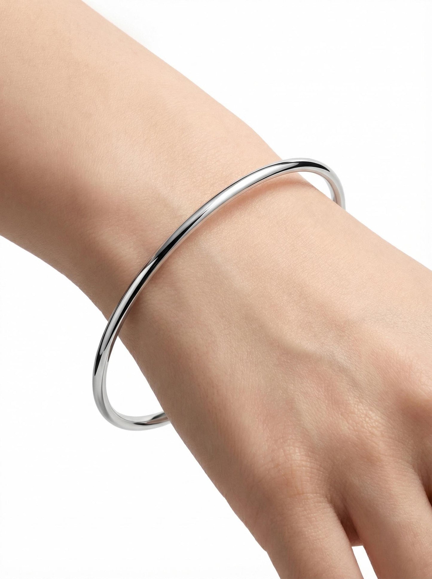 Close wrist view of solid polished platinum bangle