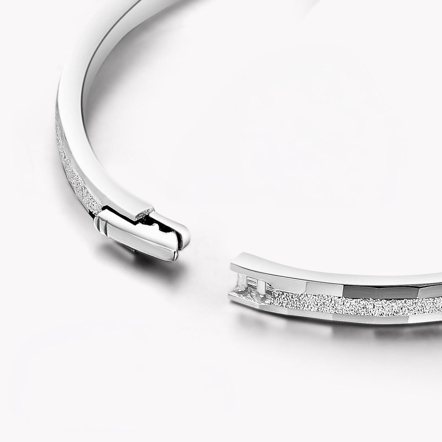 Close-up of hidden clasp on frosted platinum bangle
