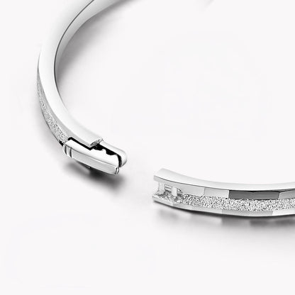 Close-up of hidden clasp on frosted platinum bangle