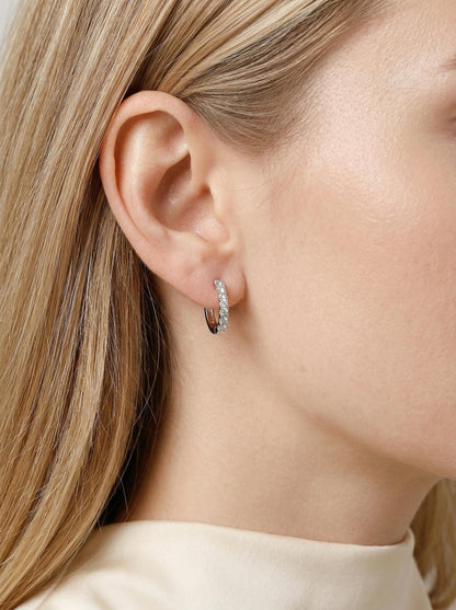 Model wearing PT950 platinum lab diamond huggie earrings