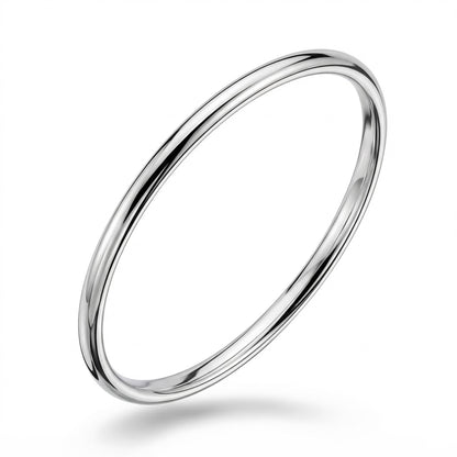 Angled view of polished solid platinum bangle