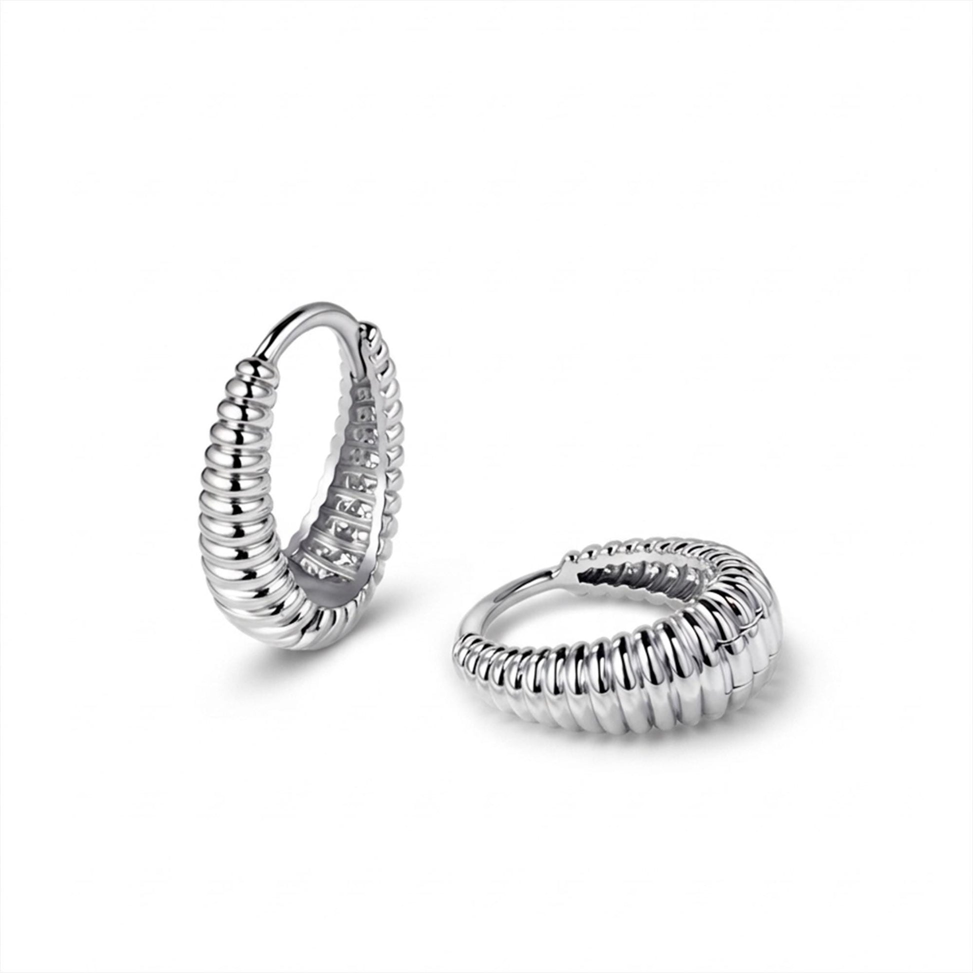 Angled pair of solid PT950 ribbed huggie hoop earrings