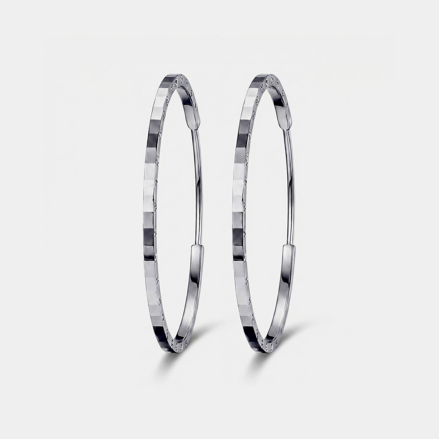 Front view of solid PT950 diamond-cut platinum hoop earrings