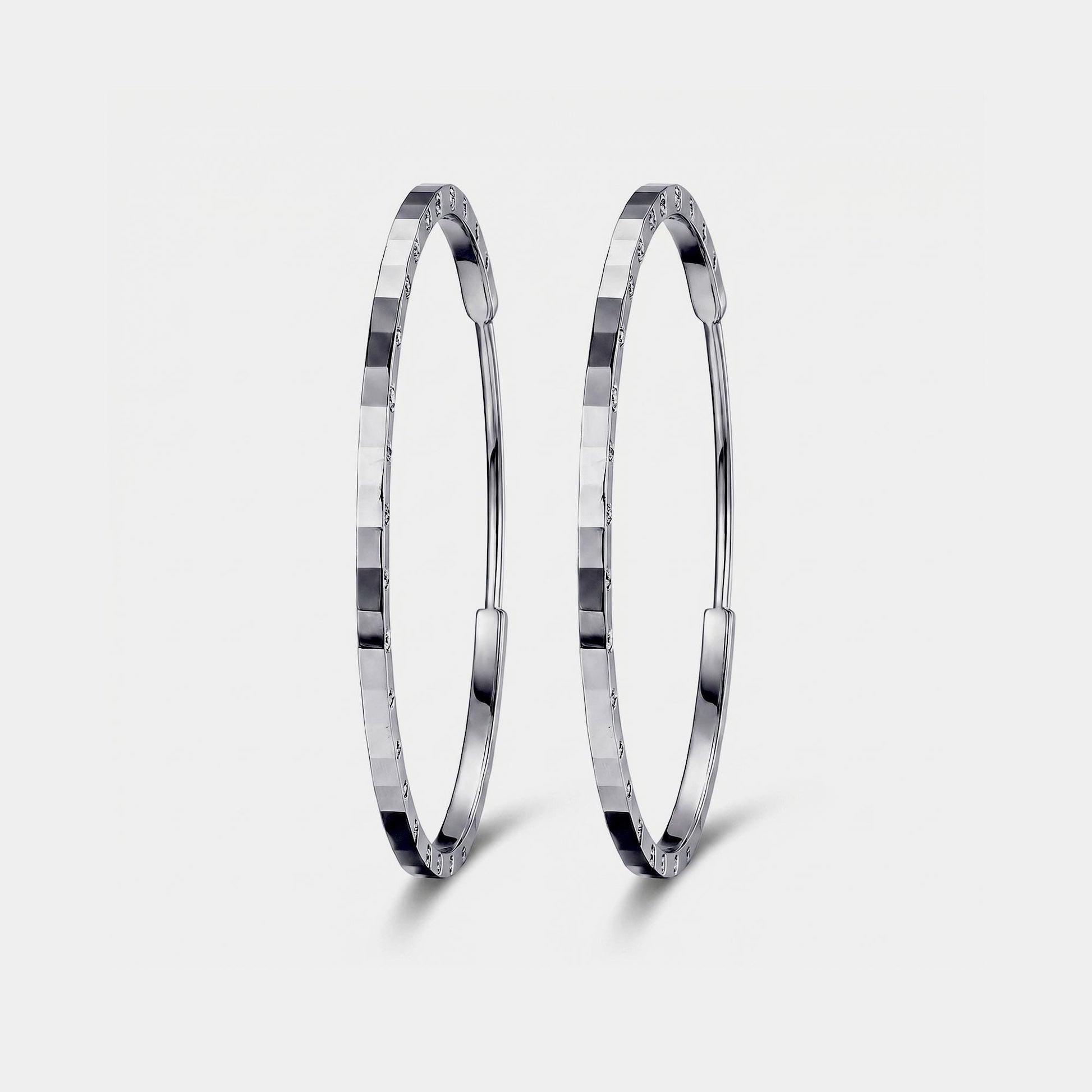 Front view of solid PT950 diamond-cut platinum hoop earrings