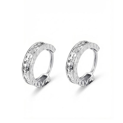 Angled pair of PT950 diamond-cut huggie hoop earrings