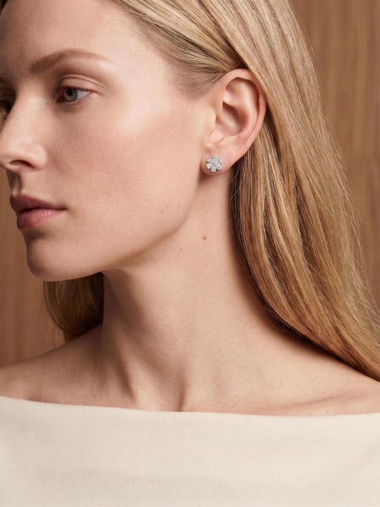 Model wearing PT950 platinum lab diamond flower stud earrings