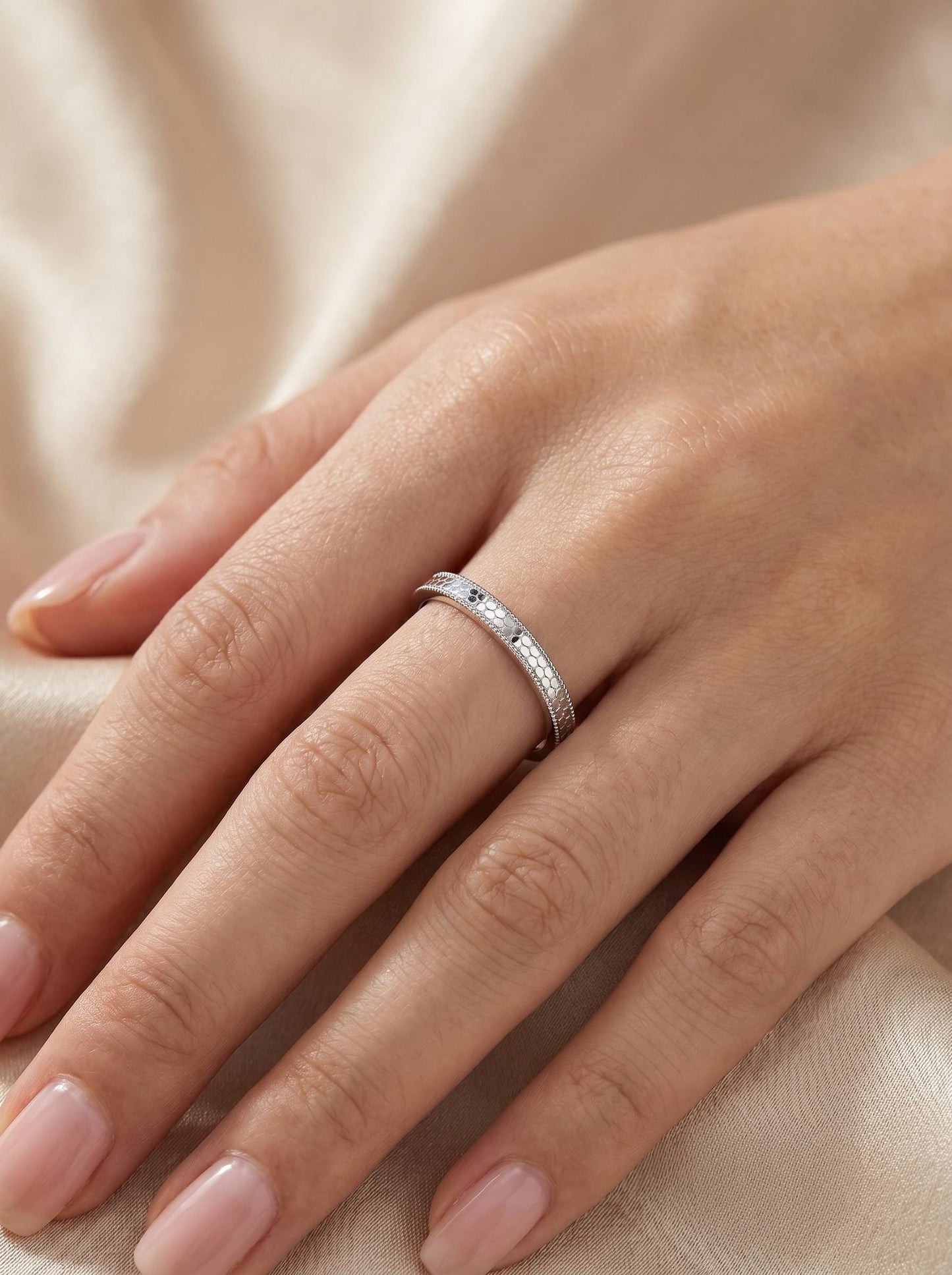 PT950 platinum faceted wedding band 2mm angled view