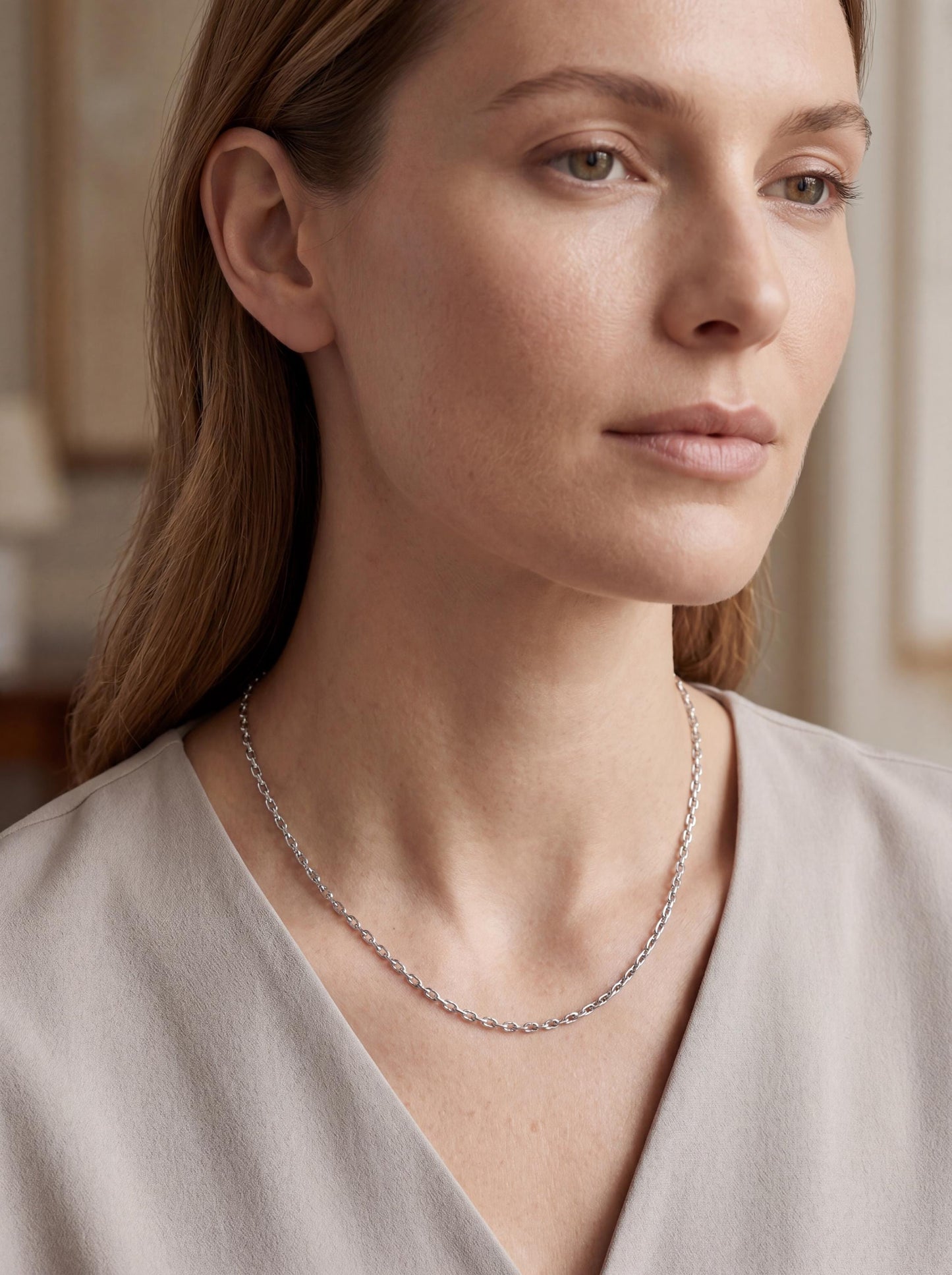 Woman wearing solid platinum elongated-link cable chain necklace