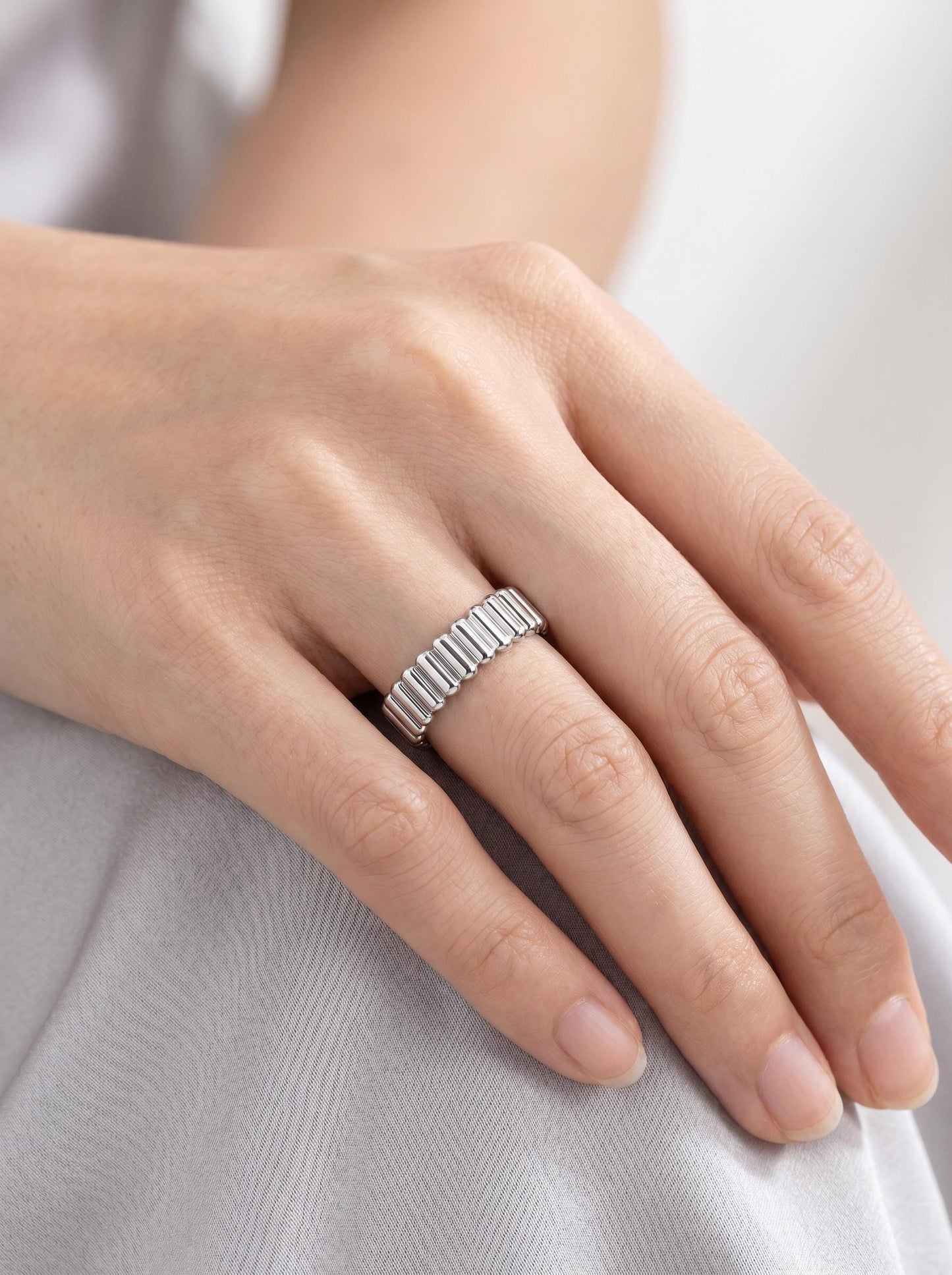 PT950 platinum ribbed wedding band 4mm angled view