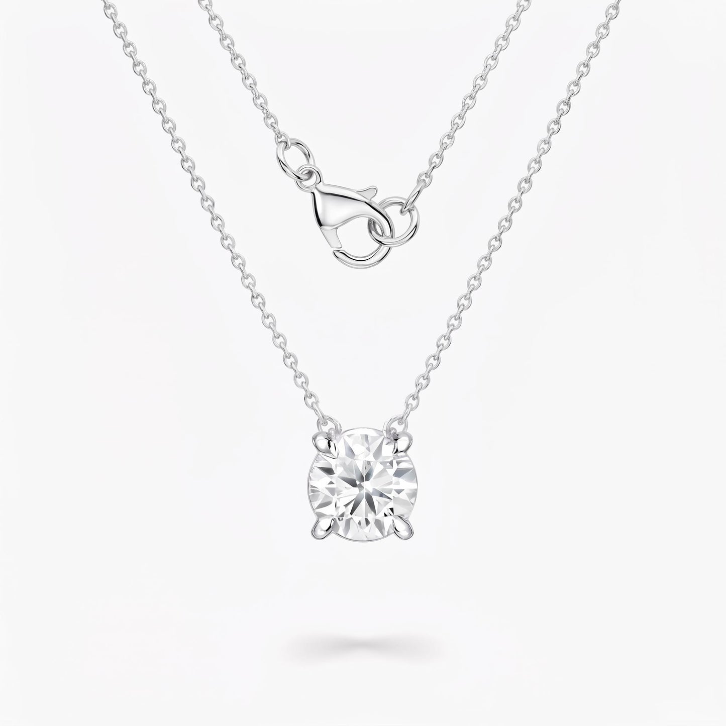 Front view of diamond solitaire necklace with platinum chain and clasp