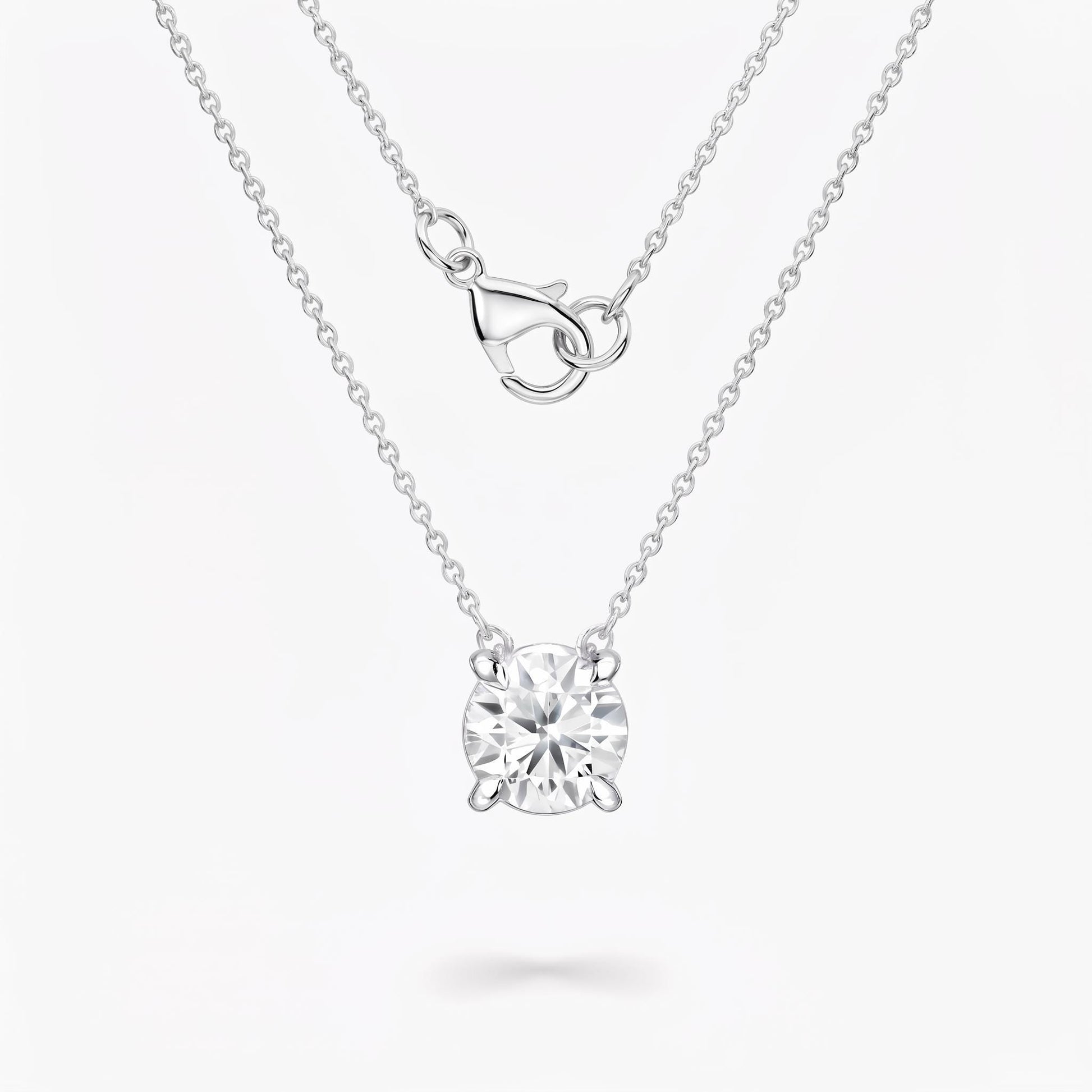 Front view of diamond solitaire necklace with platinum chain and clasp