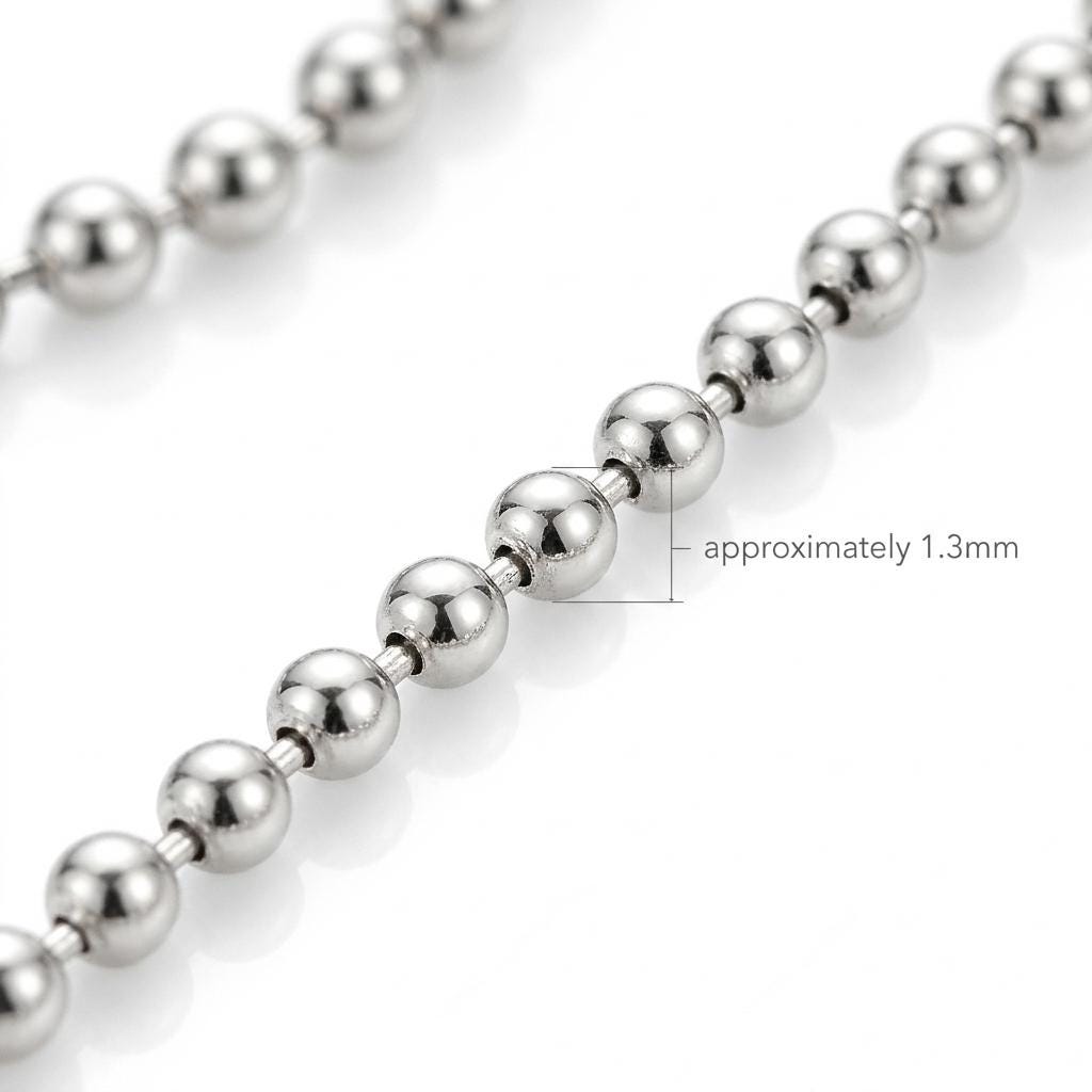 Macro detail of polished platinum ball links with 1.3mm width