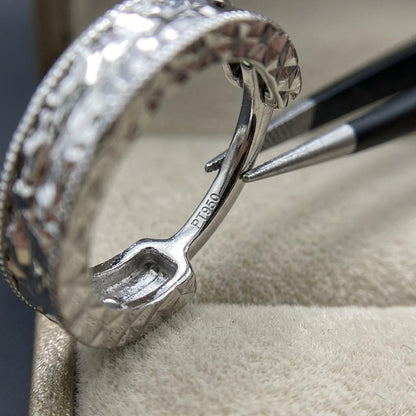 PT950 stamp and hinged clasp inside a diamond-cut huggie hoop