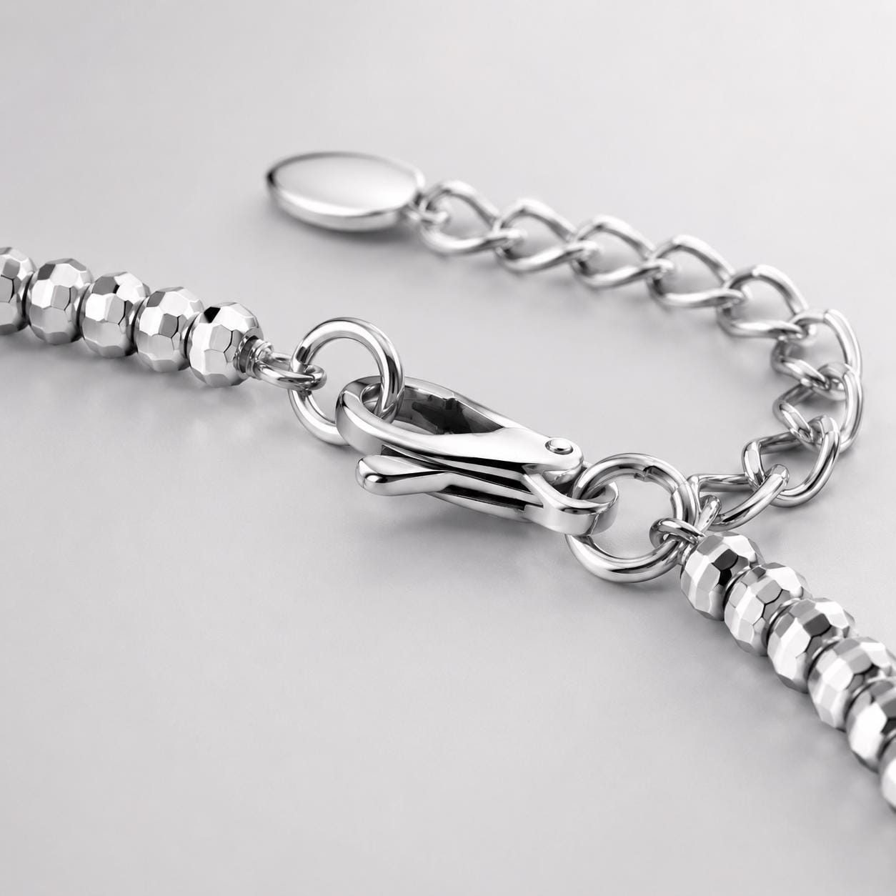 Lobster clasp and extender on faceted bead bracelet