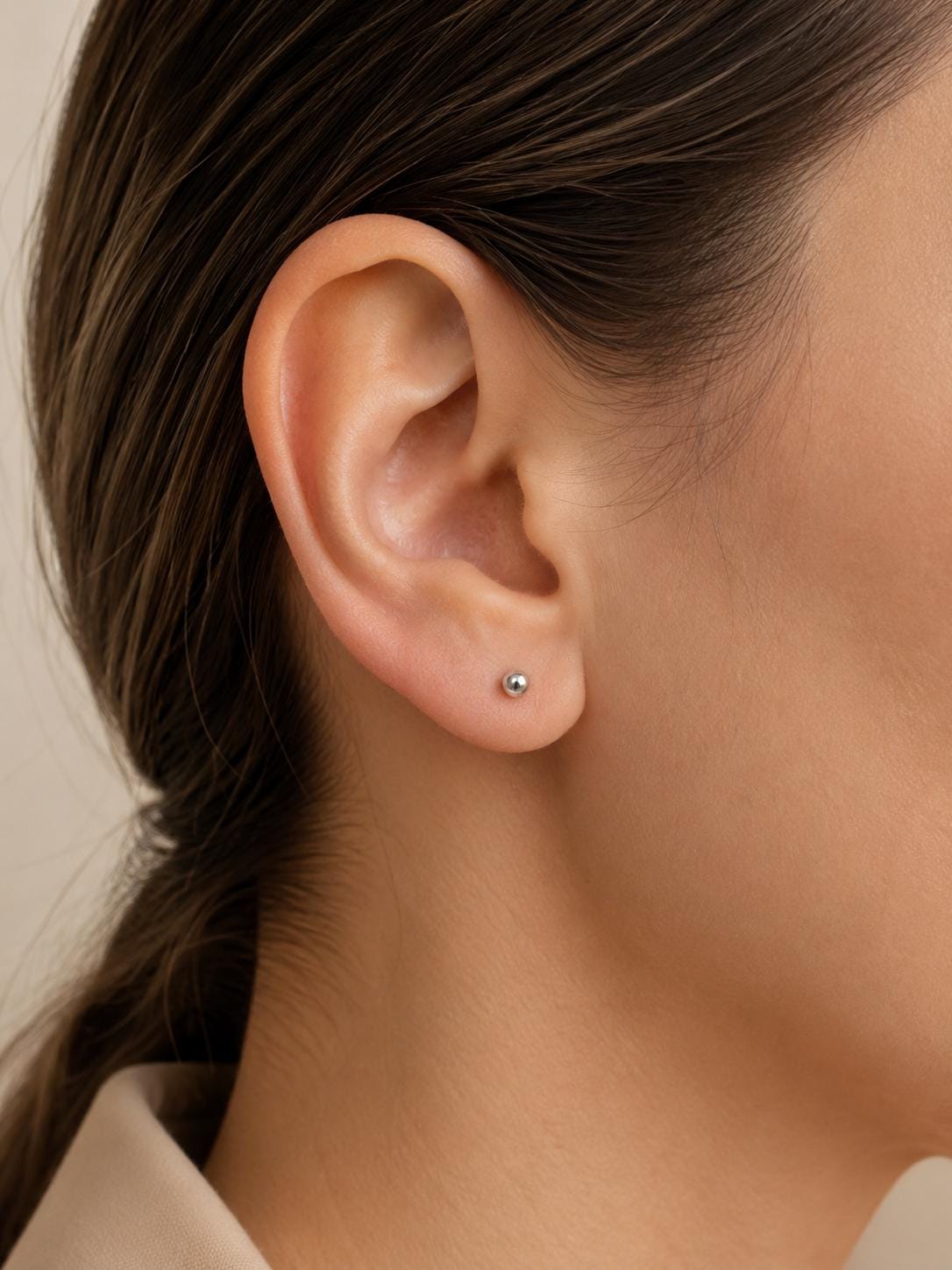 Model wearing a solid PT950 platinum 2mm micro ball stud