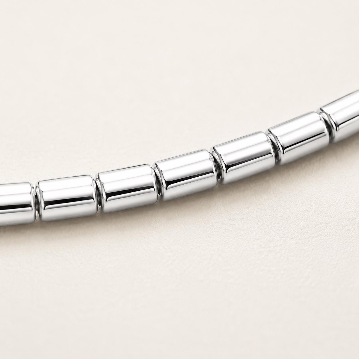 Macro detail of polished platinum barrel links