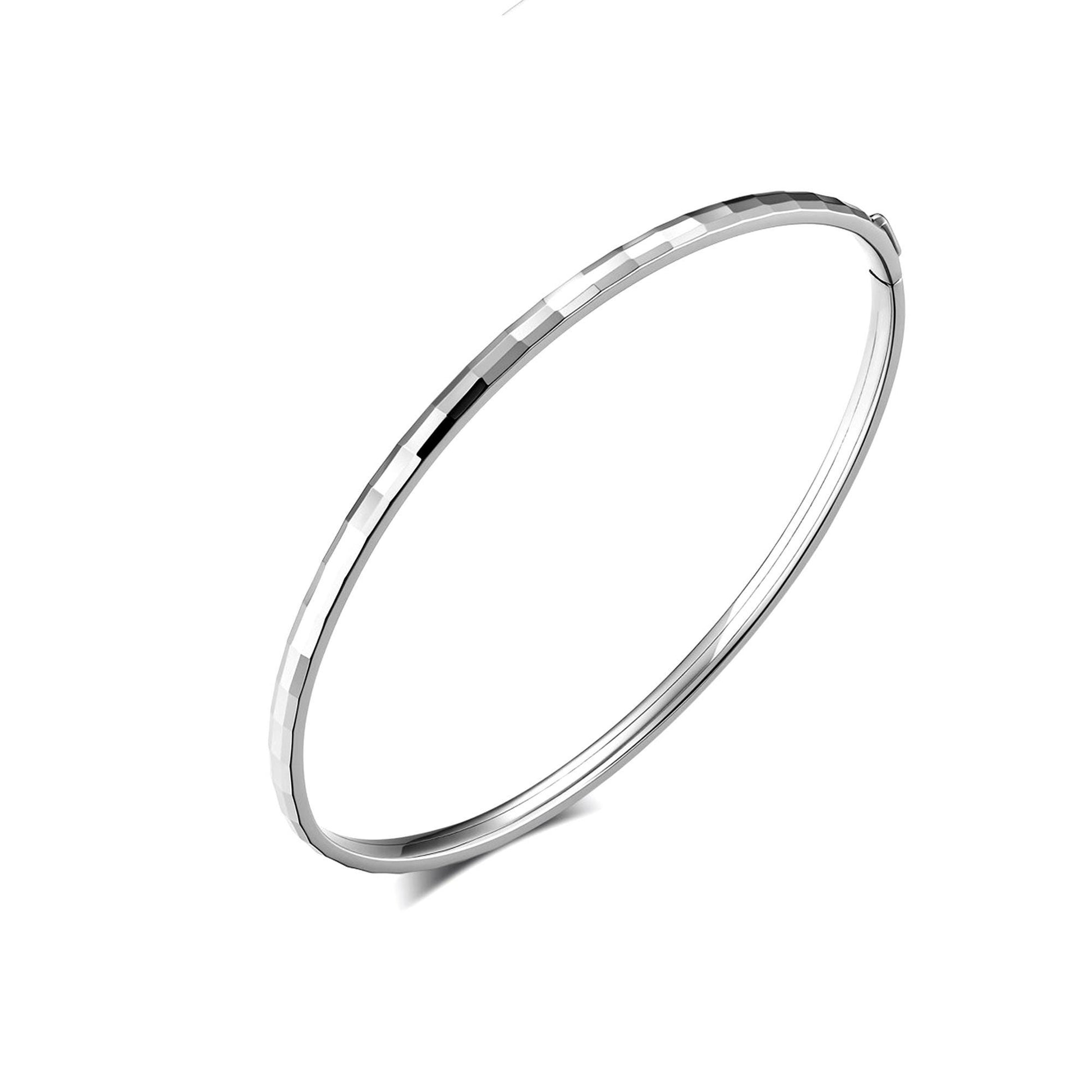 Angled view of faceted oval PT950 bangle