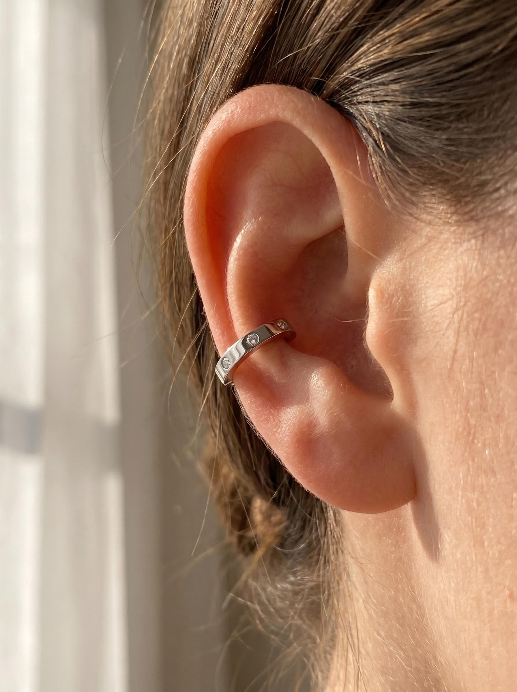 Model wearing a solid PT950 platinum 6mm cartilage huggie