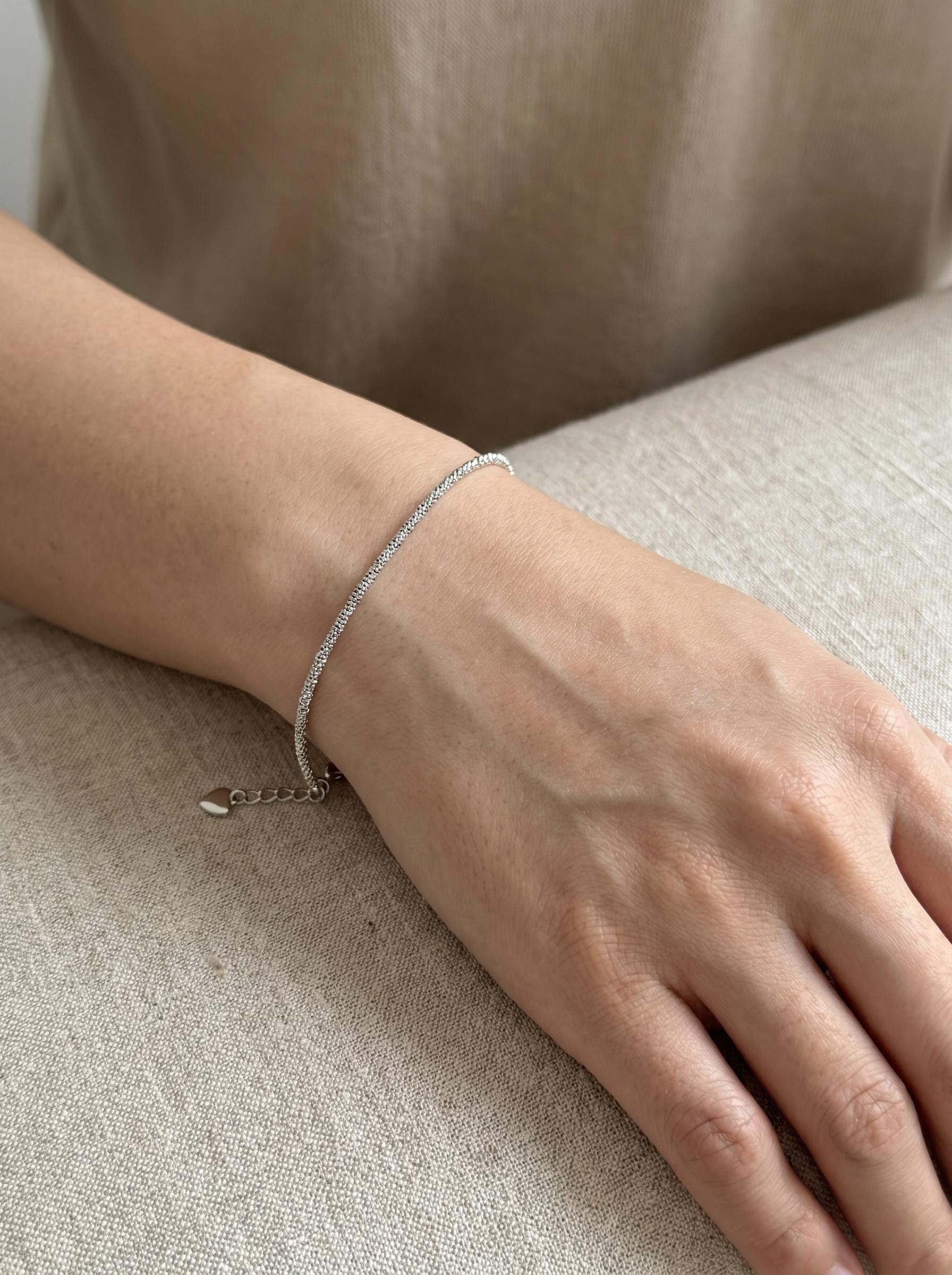 Close wrist view of adjustable PT950 chain bracelet