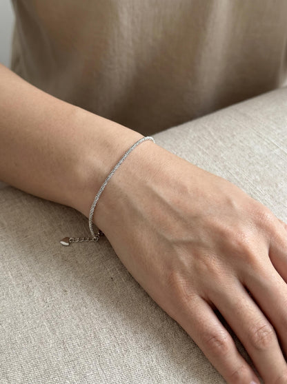 Close wrist view of adjustable PT950 chain bracelet