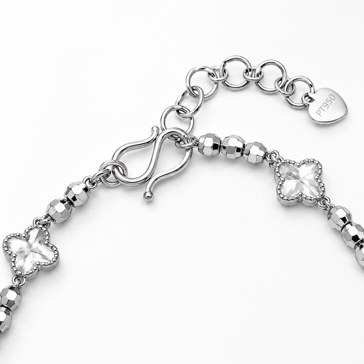 S clasp and extender on platinum clover bracelet
