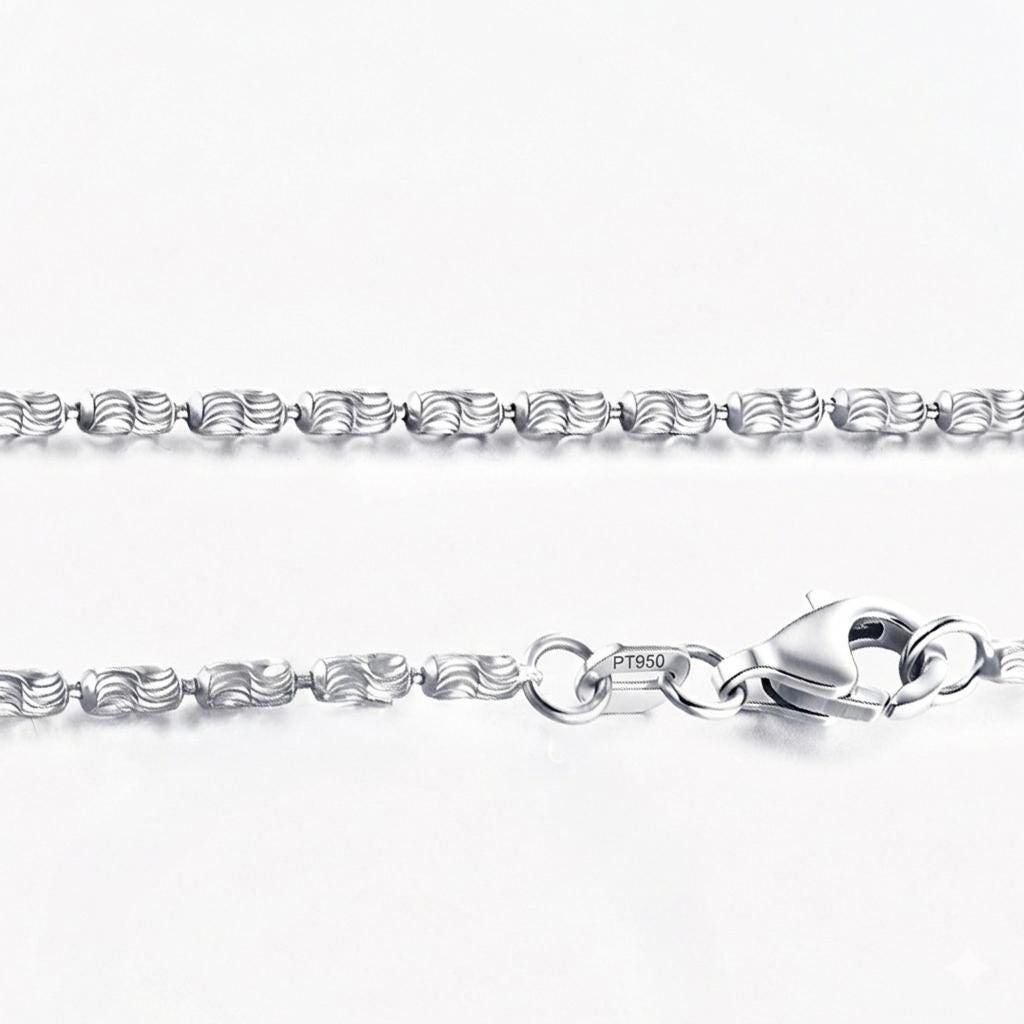 Macro detail of laser-cut platinum olive beads, lobster clasp and PT950 tag