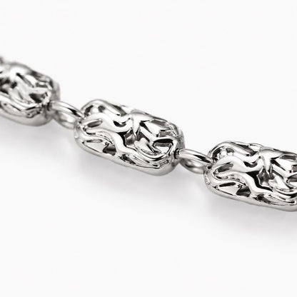 Macro detail of textured ripple platinum links