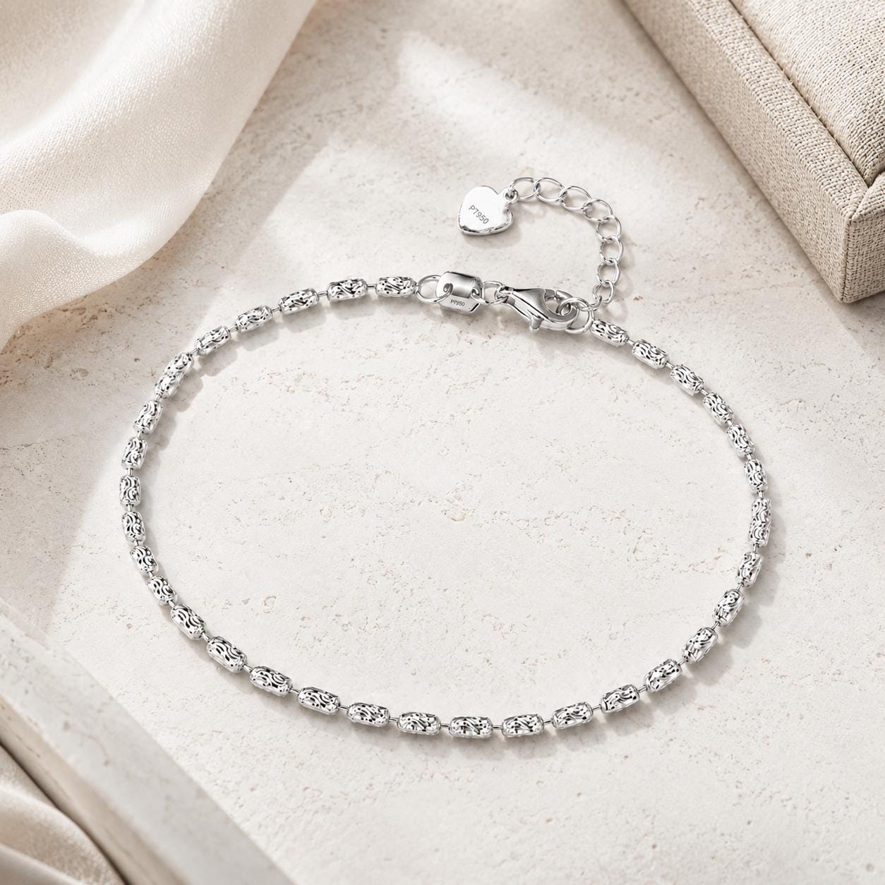 Full view of adjustable platinum ripple-link bracelet