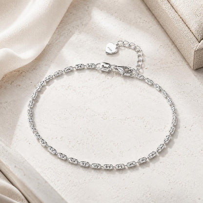 Full view of adjustable platinum ripple-link bracelet